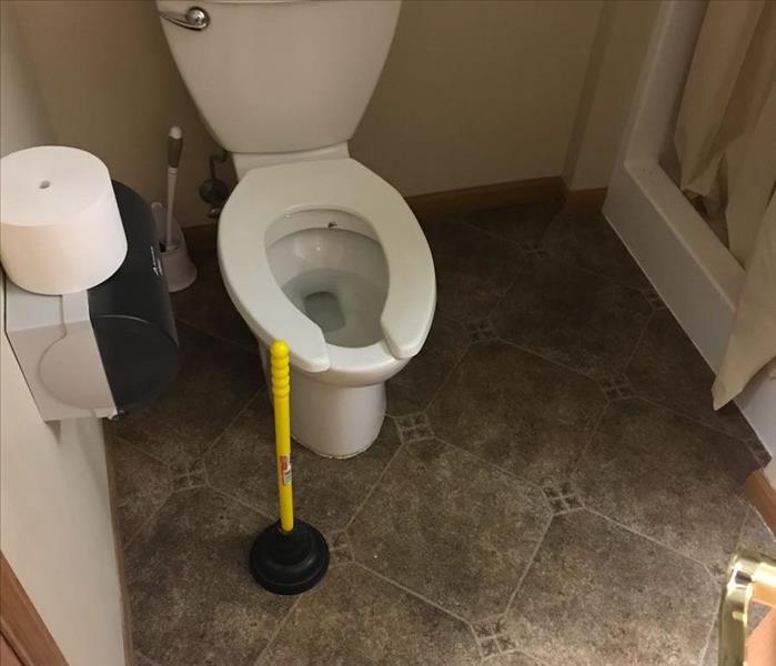 Toilet caused back up after a storm 